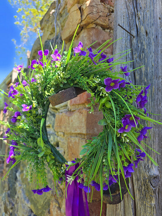 Artificial flower hair wreath - purple with small flowers and greenery