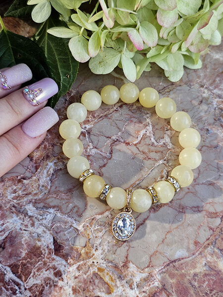 Natural stone bead bracelet - light yellow with gold color elements 
