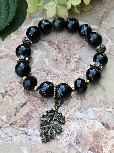 Natural stone bead bracelet - black with bronze color elements and leaf pendant