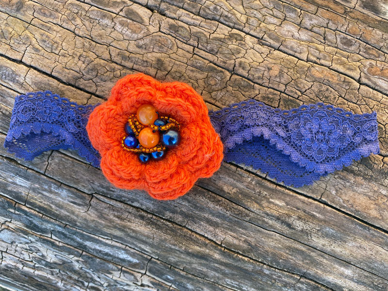 Lace headband with crocheted flower - orange with dark blue 